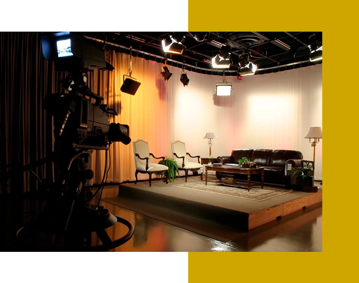 A television studio with a lot of furniture