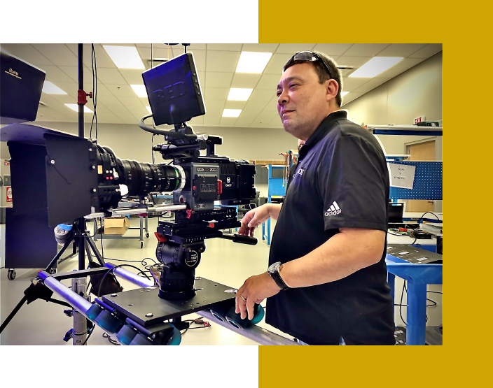 A man standing in front of a camera.