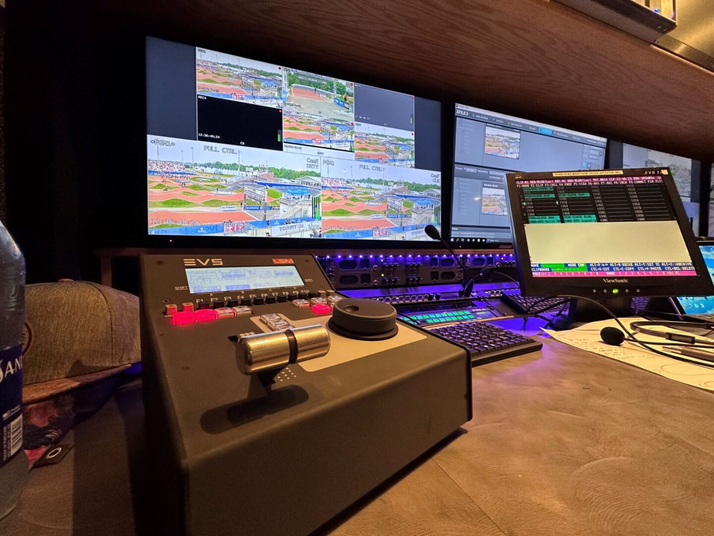 A control room with multiple monitors and keyboards.