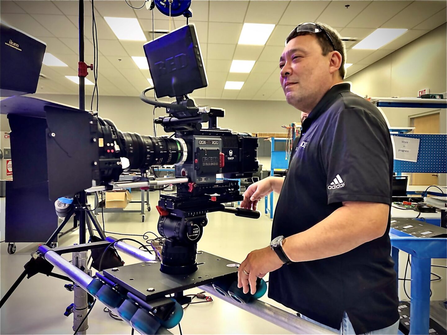 A man is working on a camera set up.